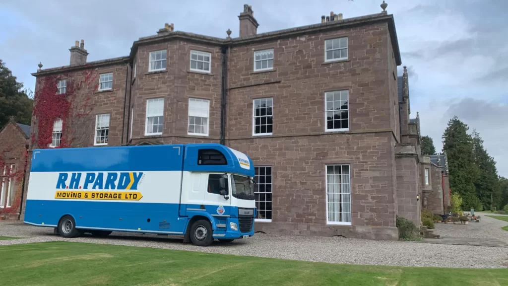 R.H-Pardy-truck-in-front-of-a- house-moving