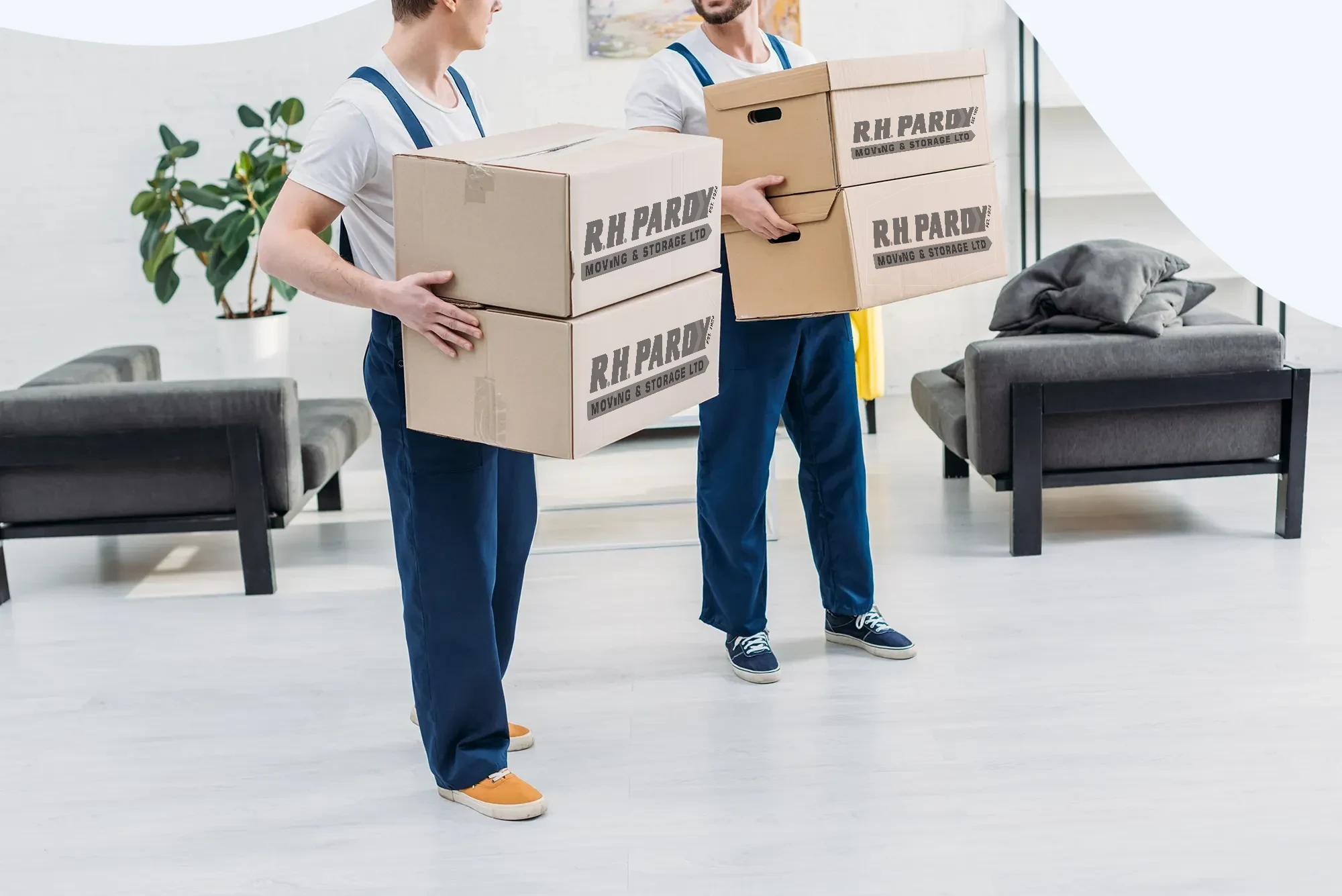 A professional removals company carrying boxes for the move